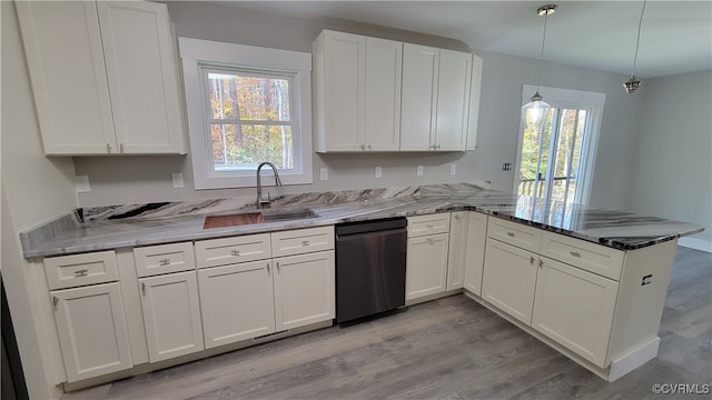 kitchen featuring dishwasher, white cabinetry, kitchen peninsula, and light wood-type flooring