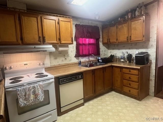 kitchen with white appliances and sink