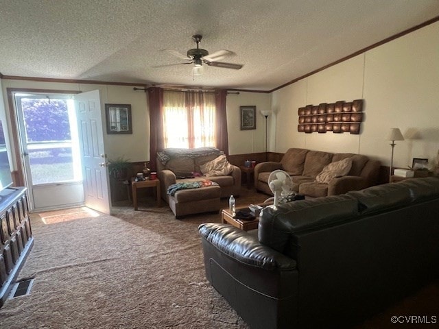 carpeted living room with ceiling fan, a textured ceiling, and crown molding