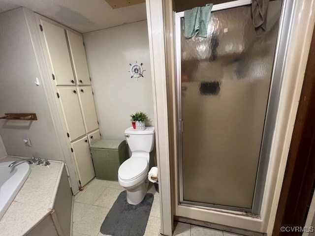 bathroom with separate shower and tub, tile patterned floors, and toilet