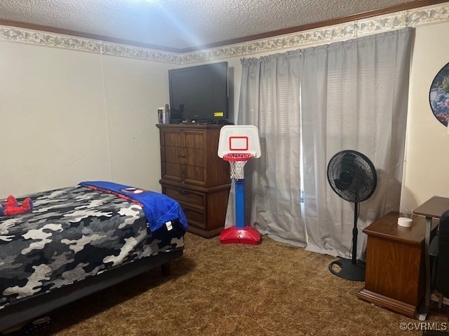 bedroom with a textured ceiling and carpet flooring