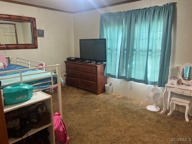 bedroom featuring ornamental molding, carpet, and multiple windows