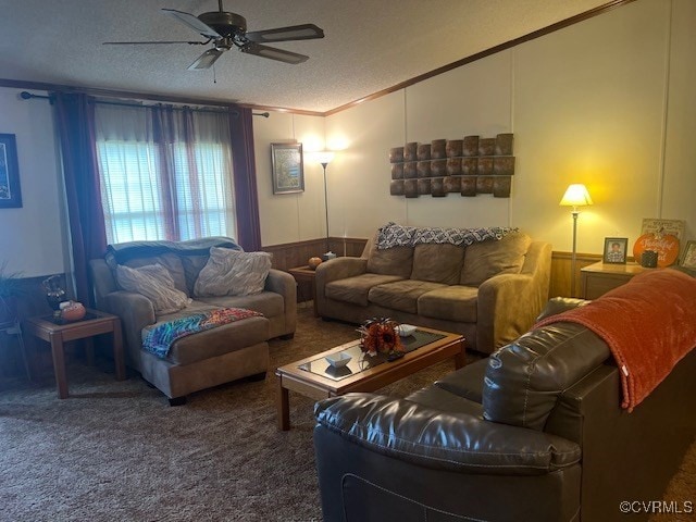 carpeted living room featuring a textured ceiling, crown molding, and ceiling fan