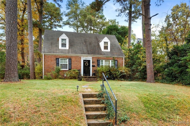 new england style home featuring a front yard