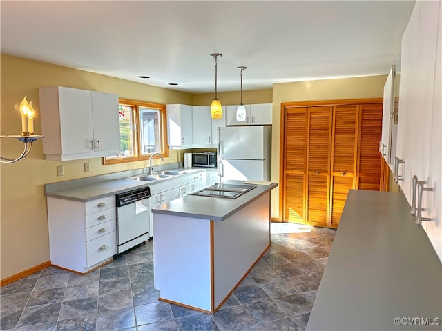 kitchen featuring a center island, white cabinets, sink, pendant lighting, and white appliances