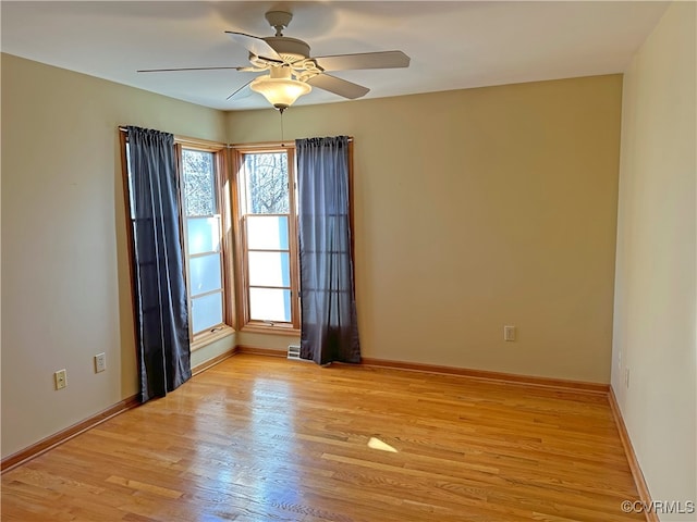 unfurnished room with ceiling fan and light hardwood / wood-style floors