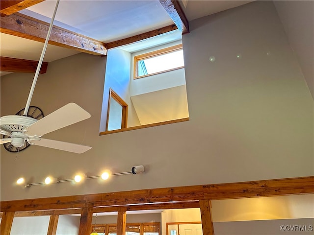 details with beamed ceiling and ceiling fan