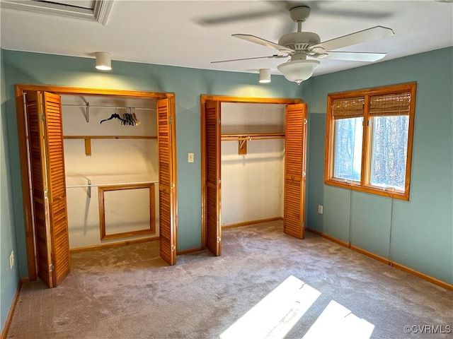 unfurnished bedroom featuring light carpet and ceiling fan