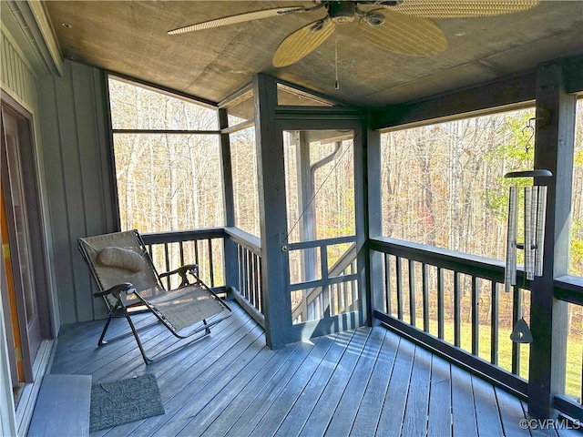 unfurnished sunroom with ceiling fan and a healthy amount of sunlight