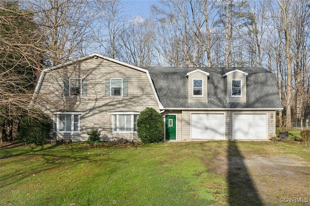 view of front facade featuring a garage and a front lawn