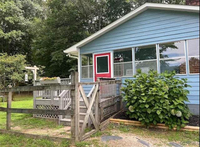 exterior space featuring a sunroom