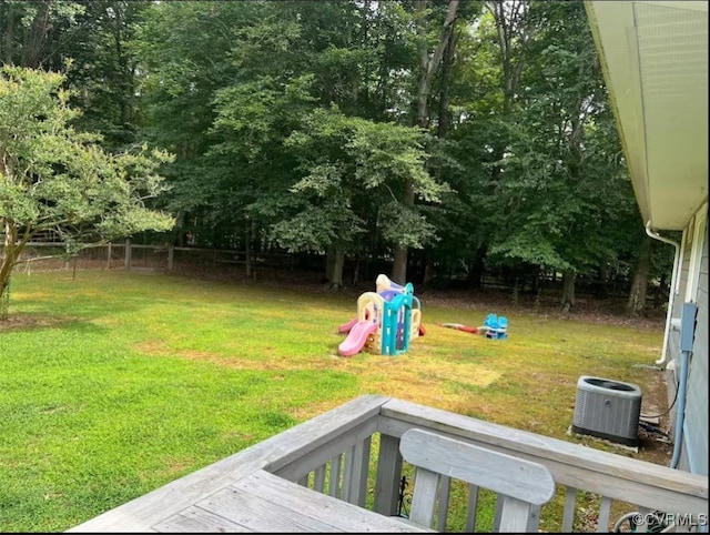 view of yard featuring central AC and a wooden deck