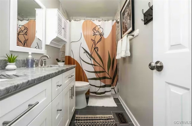 bathroom with toilet, vanity, a shower with shower curtain, and tile patterned flooring