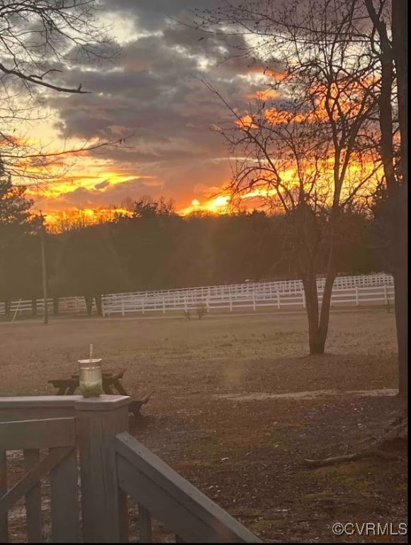 yard at dusk with a rural view