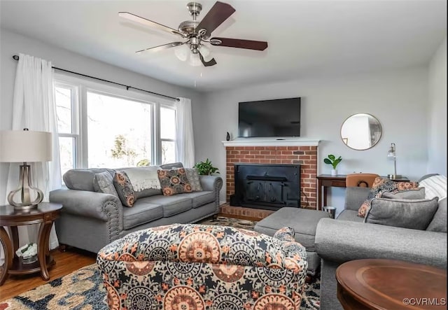 living room featuring hardwood / wood-style floors and ceiling fan