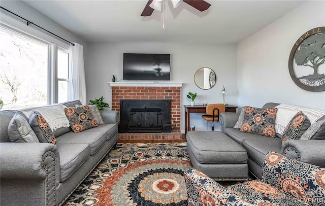 living room featuring hardwood / wood-style floors and ceiling fan