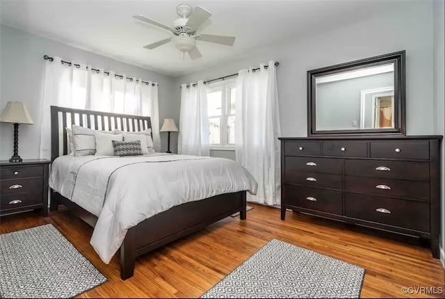 bedroom featuring hardwood / wood-style floors and ceiling fan