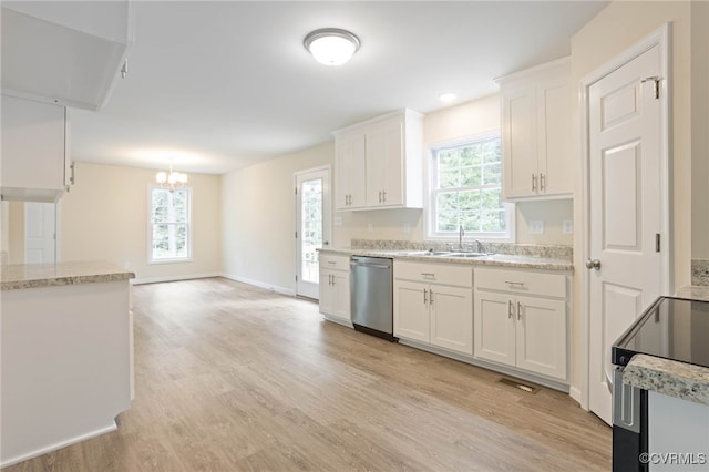 kitchen featuring a wealth of natural light, white cabinetry, light wood-type flooring, and appliances with stainless steel finishes