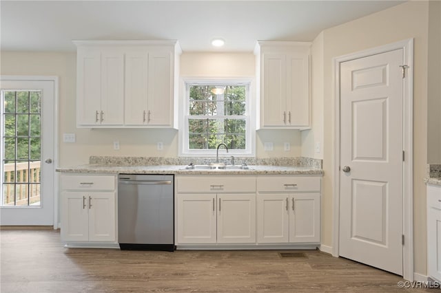 kitchen featuring white cabinets, sink, light hardwood / wood-style flooring, and dishwasher