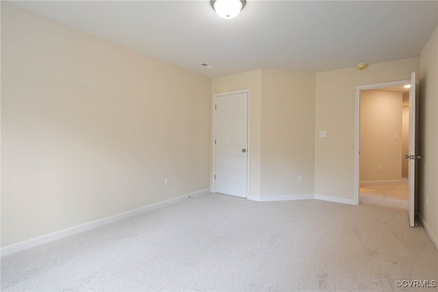 spare room with light colored carpet