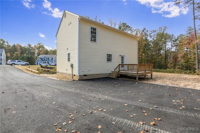 back of property with a deck