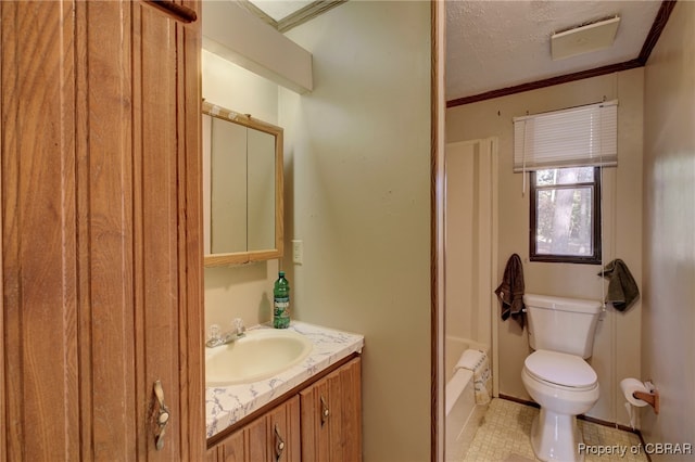 bathroom with vanity, tile patterned flooring, toilet, ornamental molding, and a textured ceiling