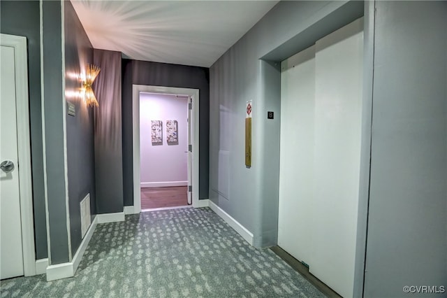 corridor with carpet flooring