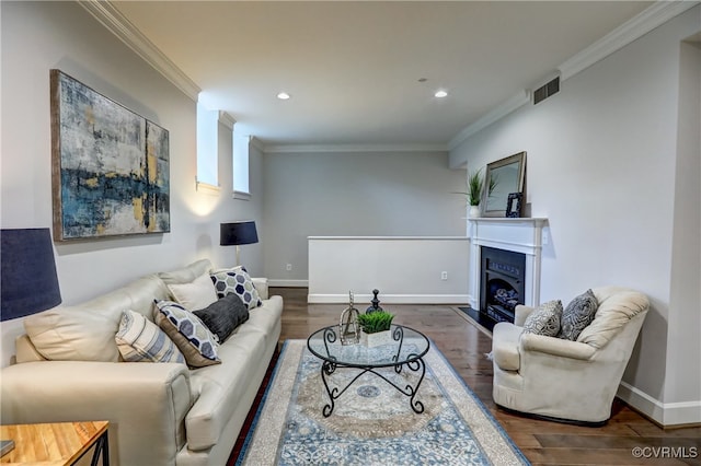 living room featuring dark wood-type flooring and crown molding