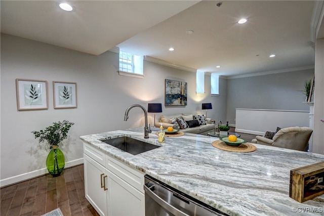 kitchen with light stone counters, ornamental molding, dark hardwood / wood-style floors, sink, and white cabinets