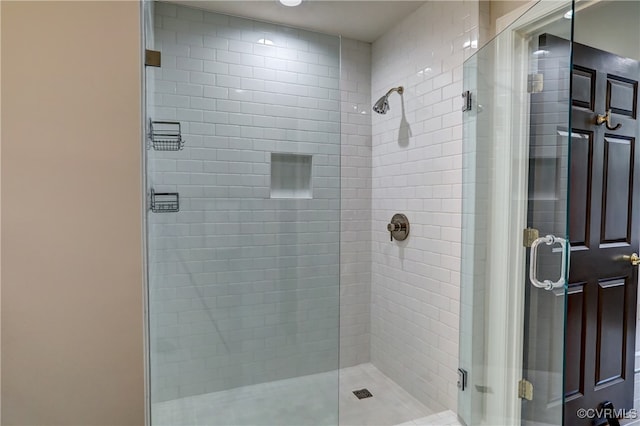 bathroom with a shower with shower door