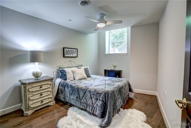 bedroom featuring ceiling fan and dark hardwood / wood-style flooring