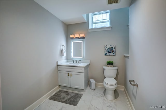 bathroom with toilet and vanity