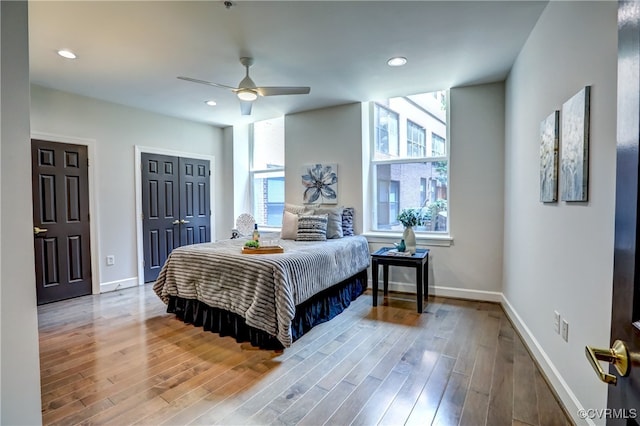 bedroom featuring ceiling fan and wood-type flooring