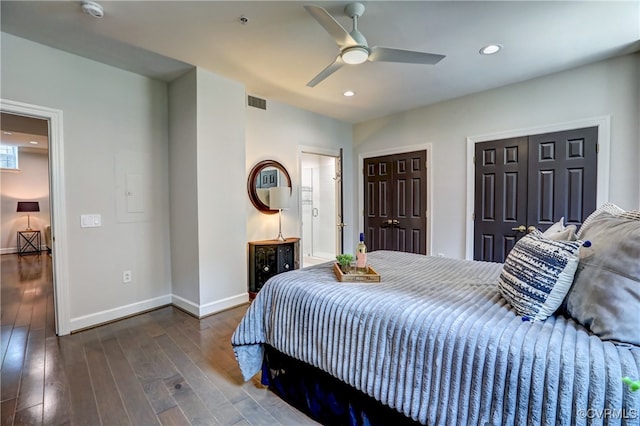 bedroom featuring dark hardwood / wood-style flooring and ceiling fan