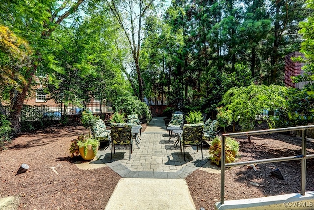 surrounding community featuring a patio