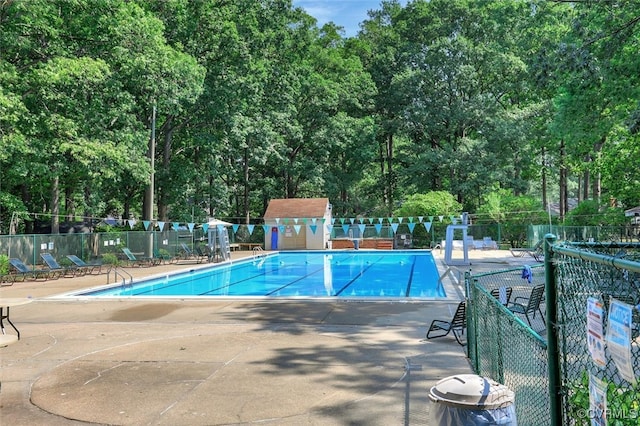 view of swimming pool featuring a patio area