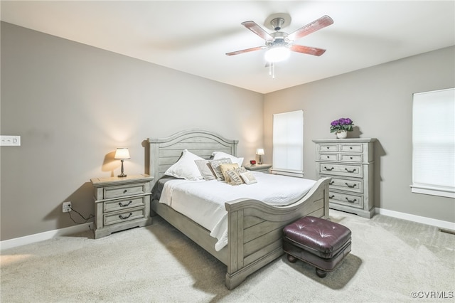 bedroom featuring ceiling fan and light colored carpet