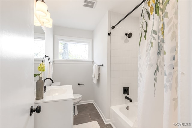 full bathroom featuring tile patterned floors, vanity, shower / bath combo, and toilet