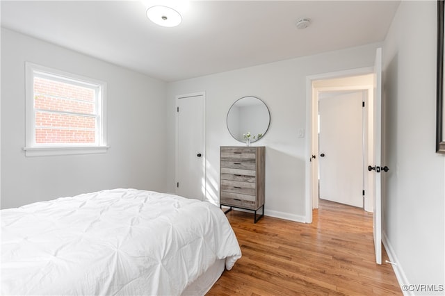 bedroom with hardwood / wood-style flooring