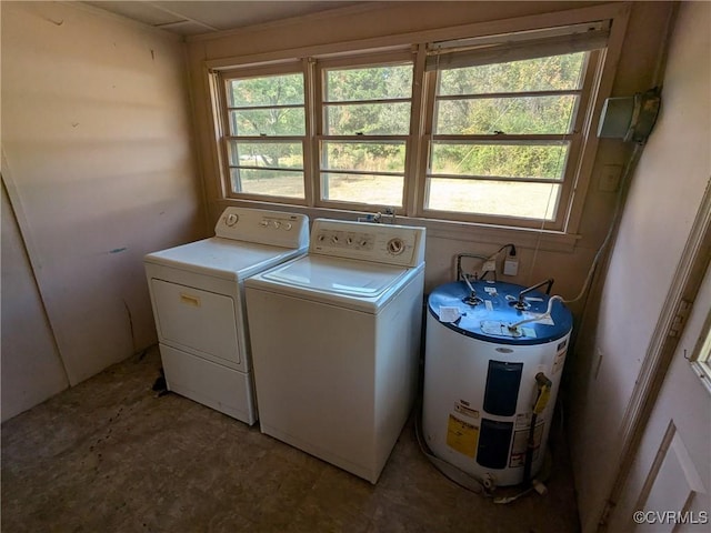 washroom featuring electric water heater and washing machine and clothes dryer