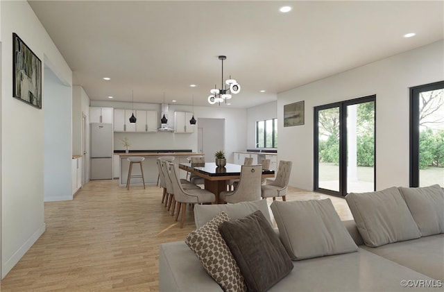 dining room featuring light hardwood / wood-style floors and an inviting chandelier