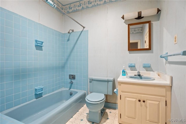 full bathroom with vanity, toilet, and tiled shower / bath