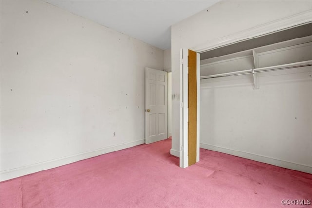 unfurnished bedroom with carpet floors and a closet