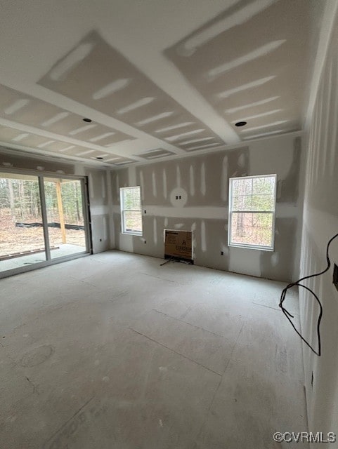 unfurnished living room featuring a garage