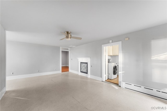 unfurnished living room featuring independent washer and dryer, ceiling fan, and a baseboard heating unit