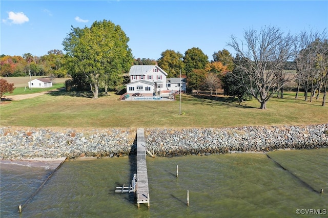 exterior space with a dock and a water view