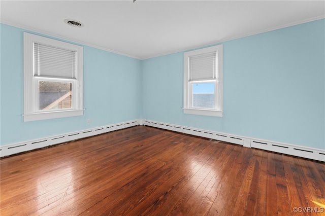 empty room with wood-type flooring and ornamental molding