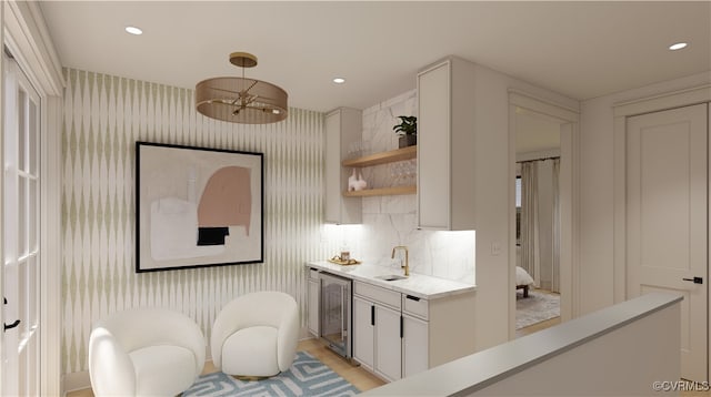 kitchen featuring pendant lighting, recessed lighting, white cabinetry, open shelves, and wallpapered walls