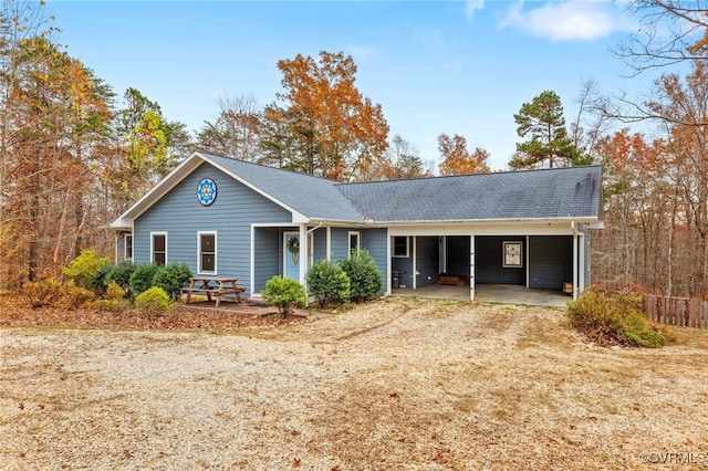 ranch-style house with a carport