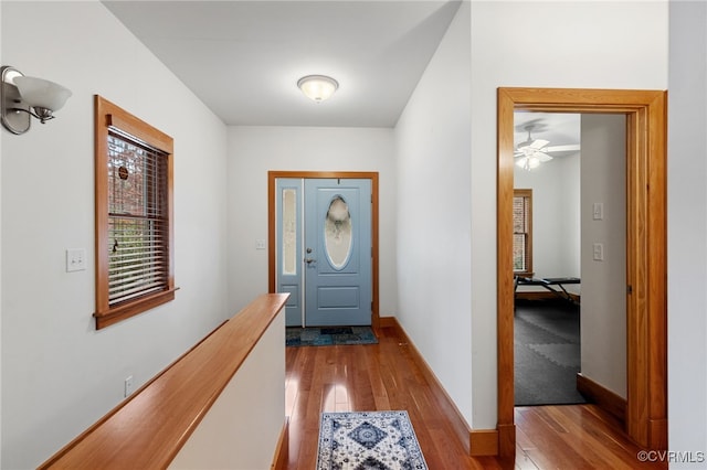 doorway to outside featuring light hardwood / wood-style flooring and ceiling fan